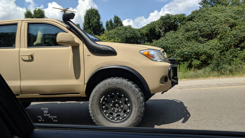 Illustration for article titled Check Out This Militarized Toyota Hilux and Its Weird Door Handles
